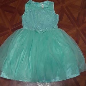 A aqua colored girls dress.